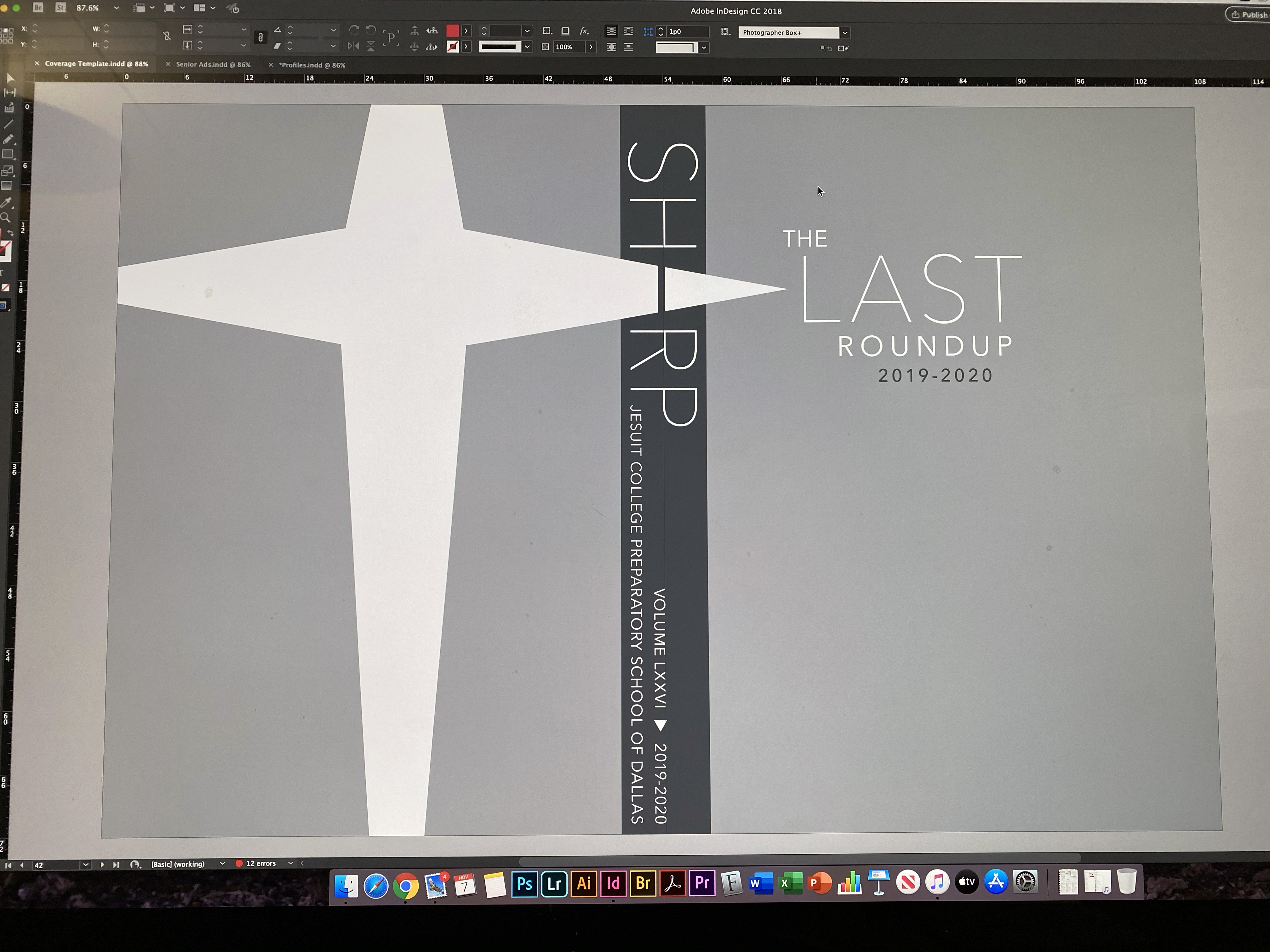 The Sharp yearbook cover and layout system being refined in Adobe InDesign.